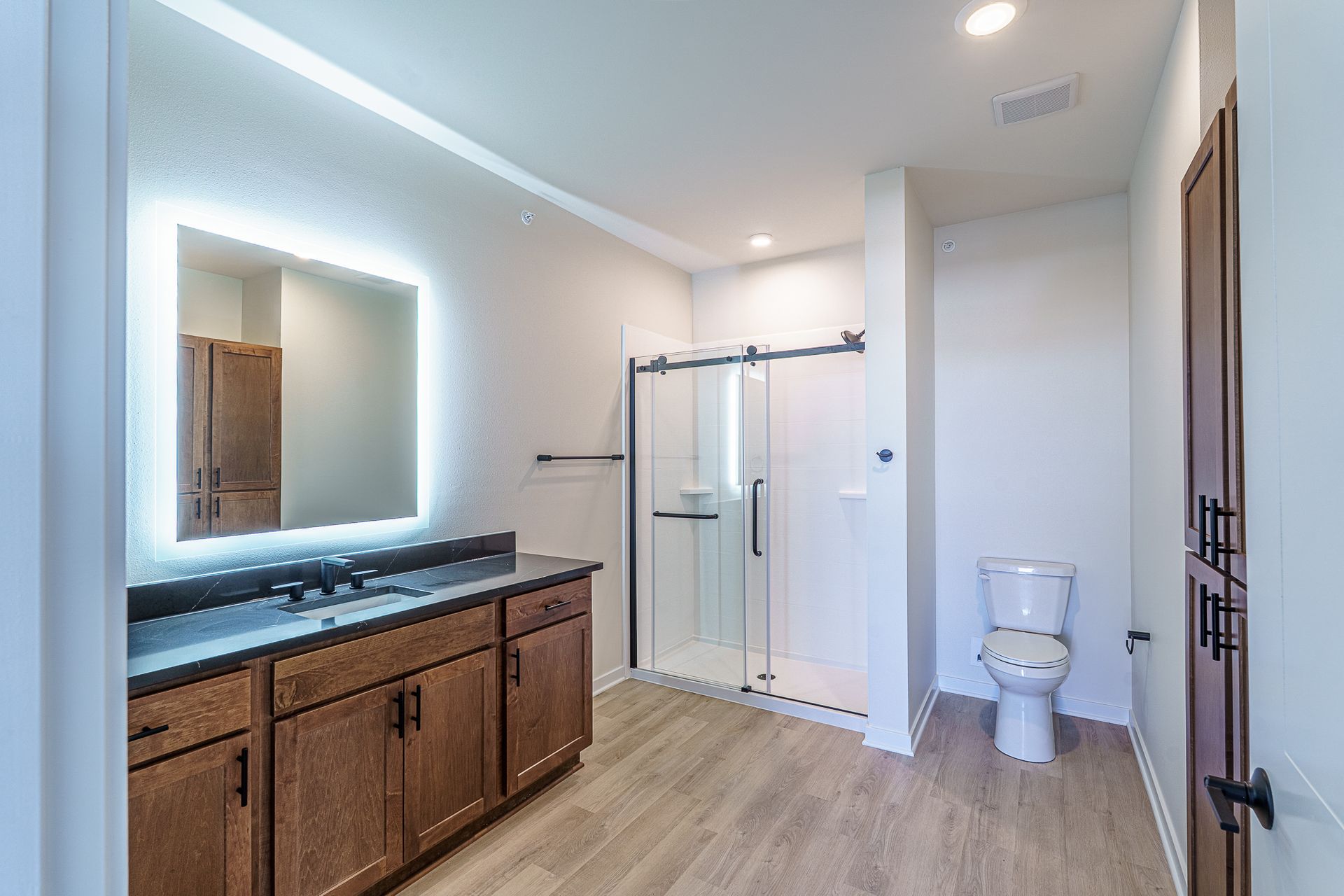 Photo of a large bathroom with a stall-type shower