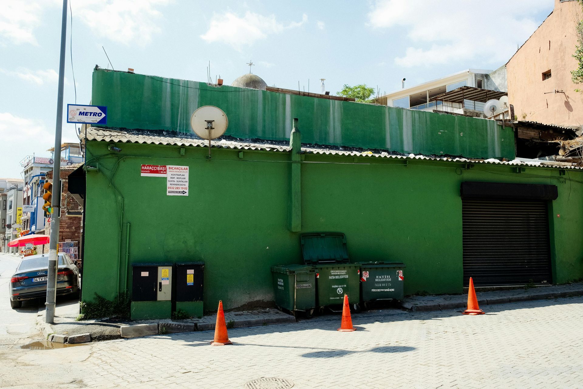 Basement room under construction, with concrete block walls, wooden framing, and window.