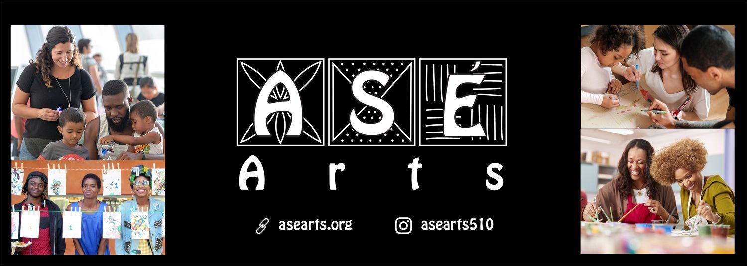A group of people are sitting at a table in front of a sign that says ase arts.