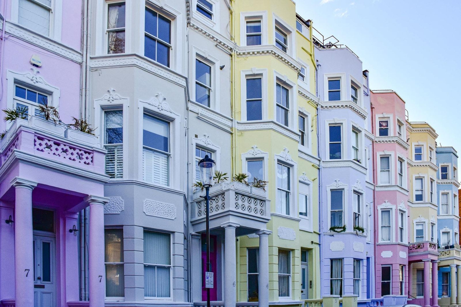 A row of colorful houses on a sunny day.