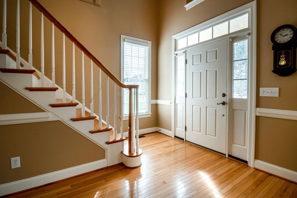 There is a staircase leading up to the second floor of a house.