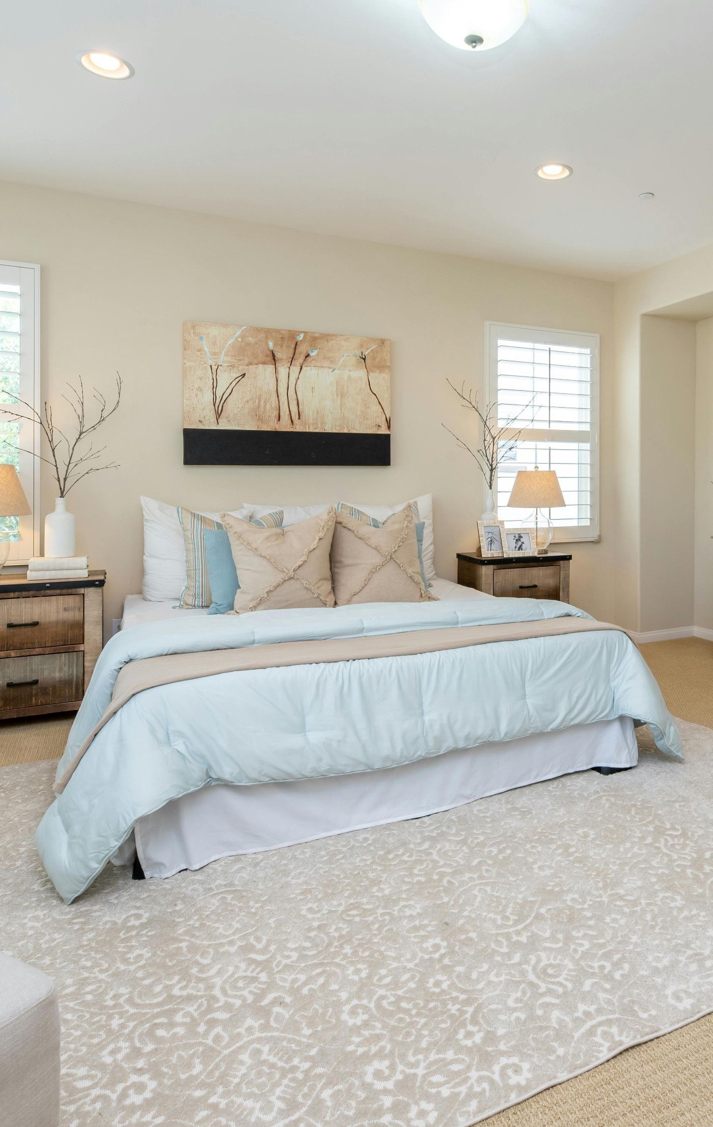 There is a large bed in the middle of the room.
