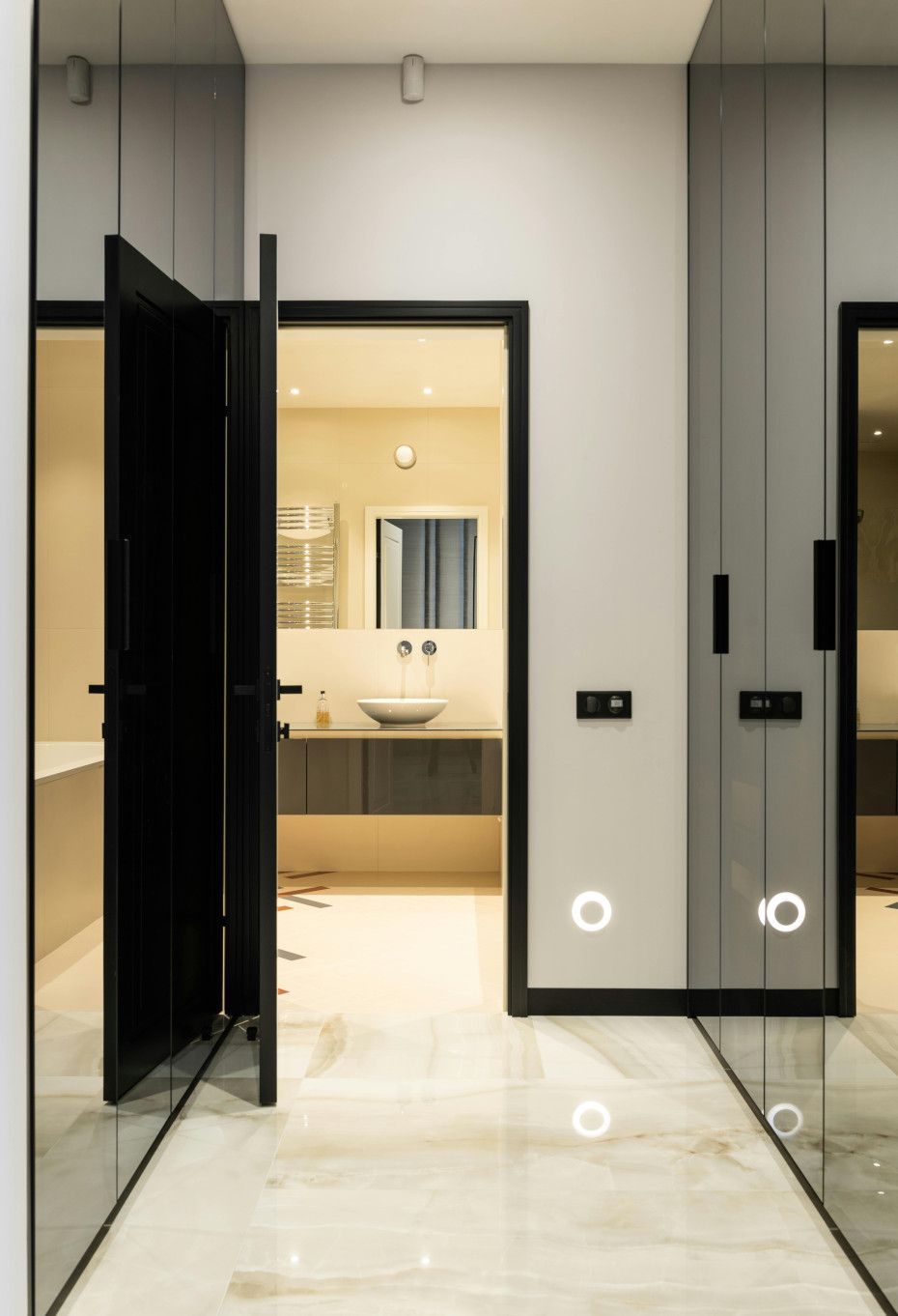 A bathroom with a sink and a mirror on the wall.