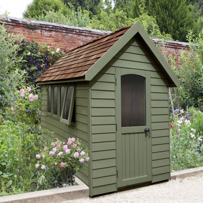 Green shed in Preston, UK. Expertly painted by Rose Decor.