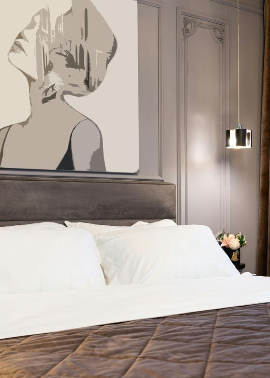 A well painted dark bedroom with a mural of a lady, in Preston, England.