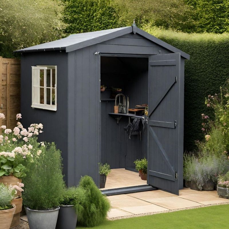 Dark grey shed in a garden in Preston, UK. Expertly painted by Rose Decor.