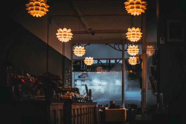 Dining venue with varied lighting and religious features