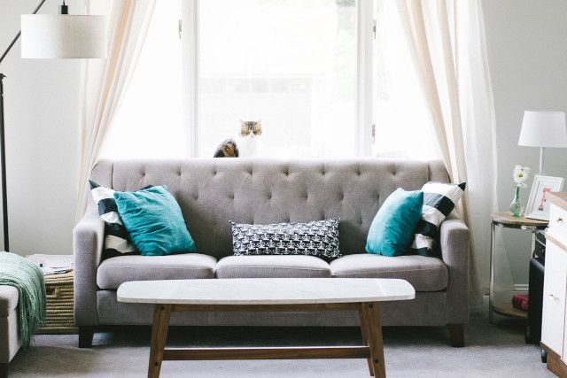 Family bedroom with comfortable seating and baby furniture