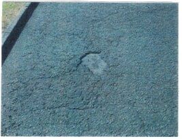 A layer of asphalt that needs asphalt repair in Millbury, MA