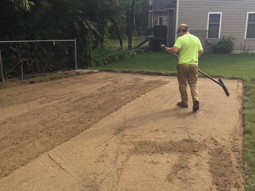 Paving Construction — Man Flatting the Ground in Worcester, MA