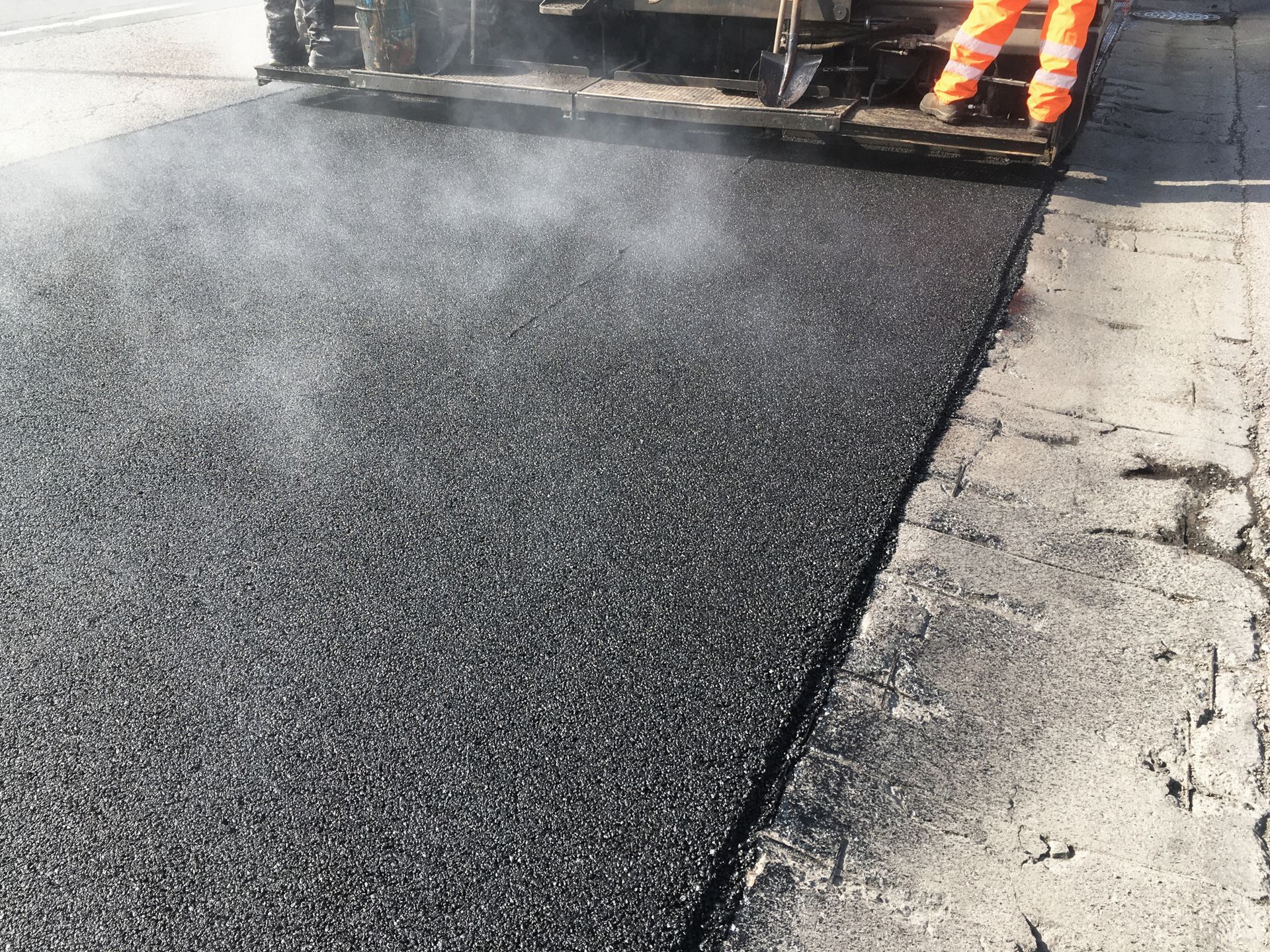 Road resurfacing showcasing high-quality lasik asphalt paving in progress for smooth streets