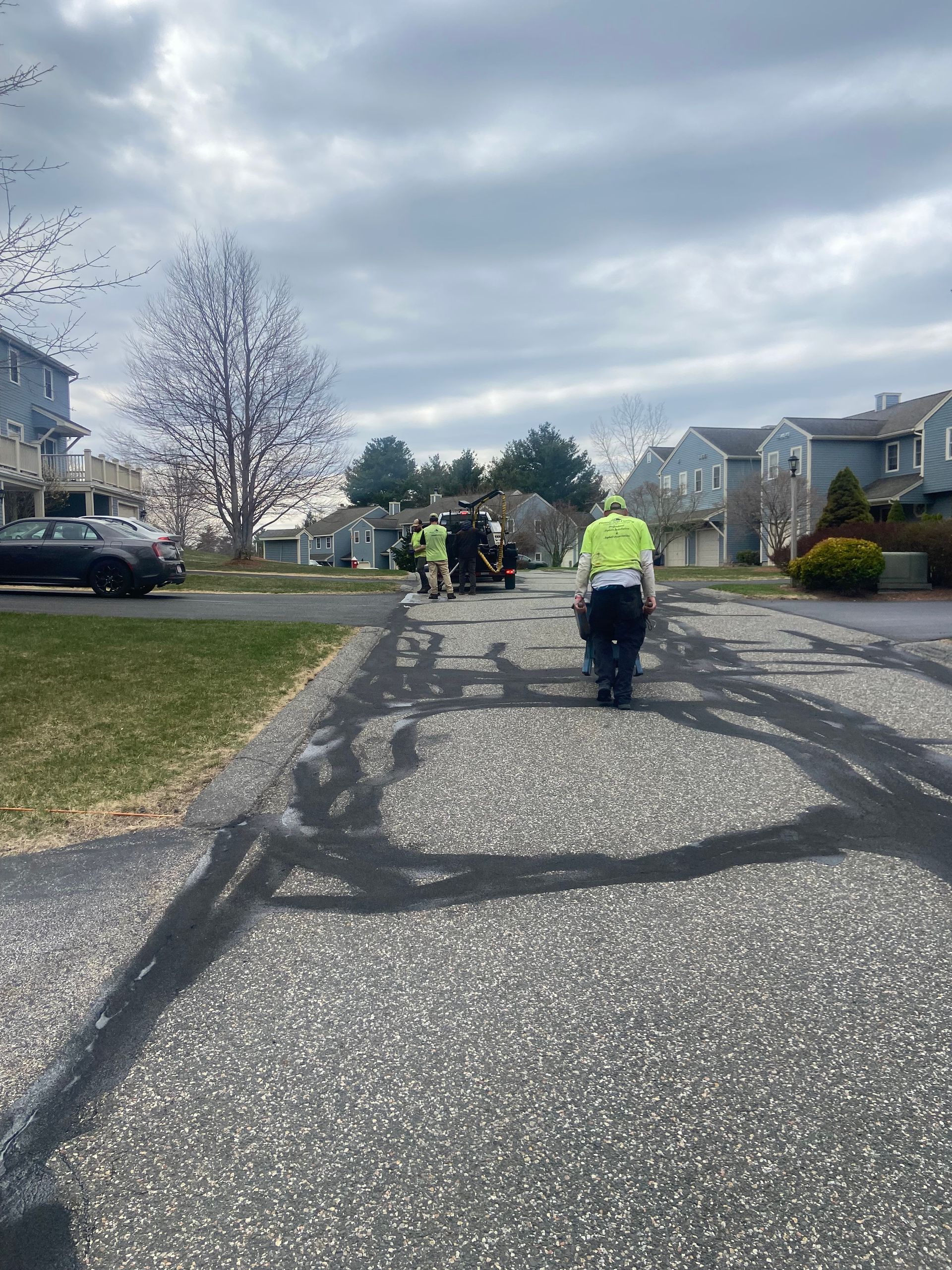 A group of people are walking down a street.