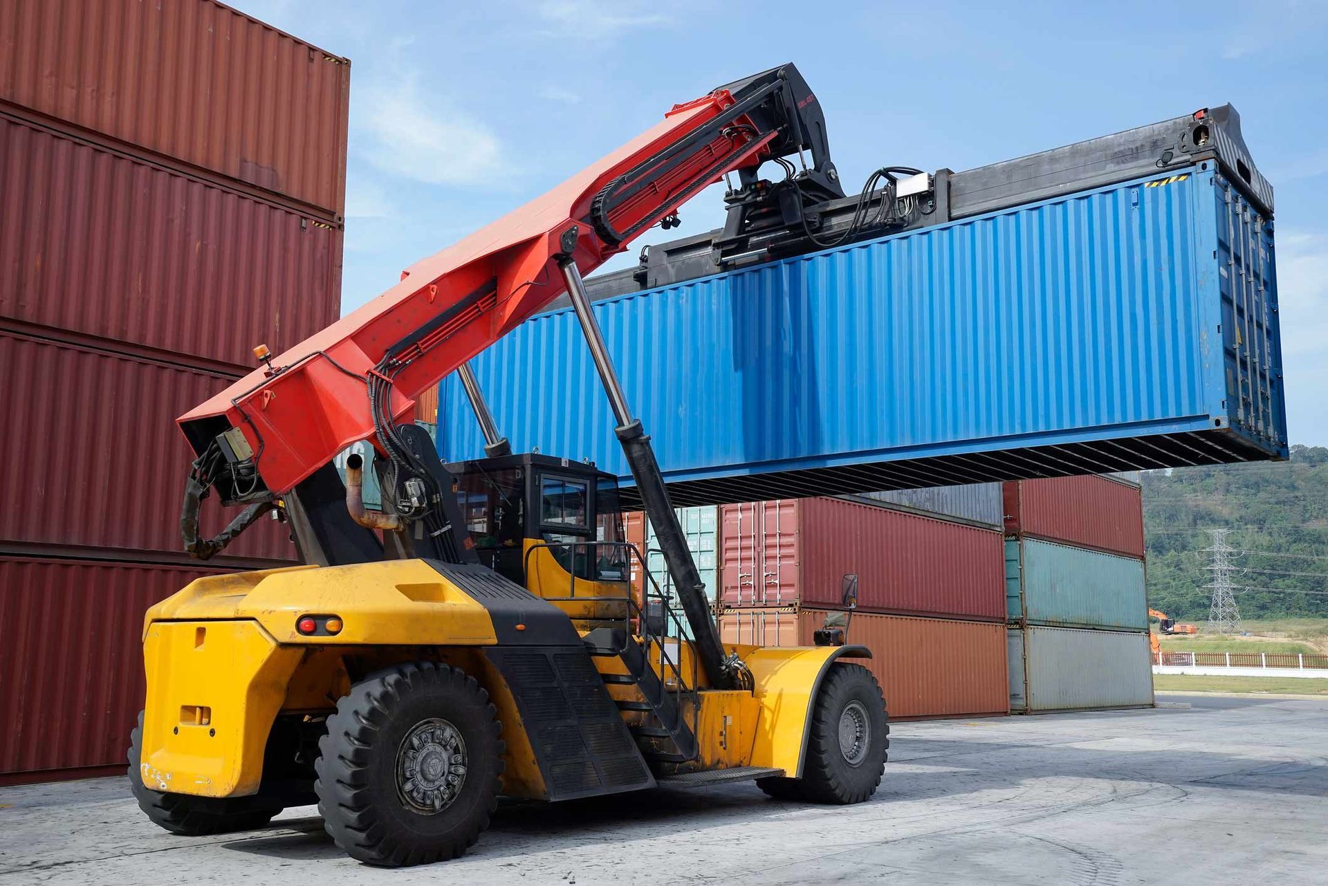 Lifting blue container | Derrimut, VIC | Discount Forklifts