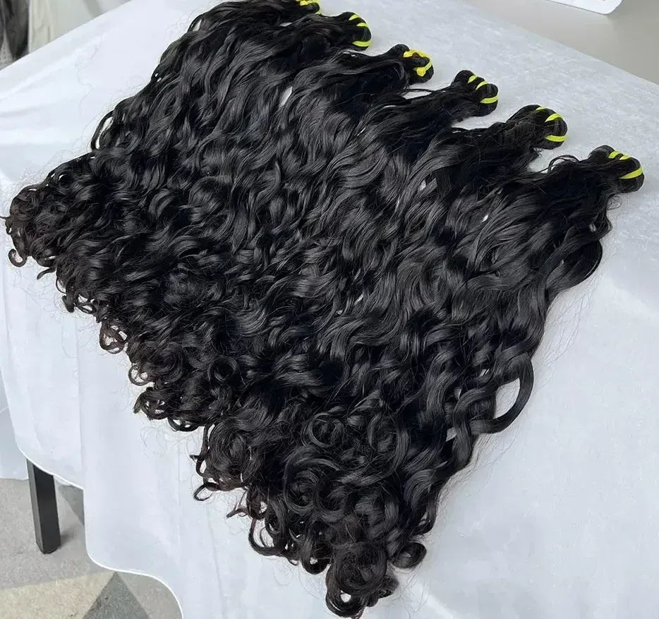 alt="Curly virgin hair bundles with defined curls and full volume"