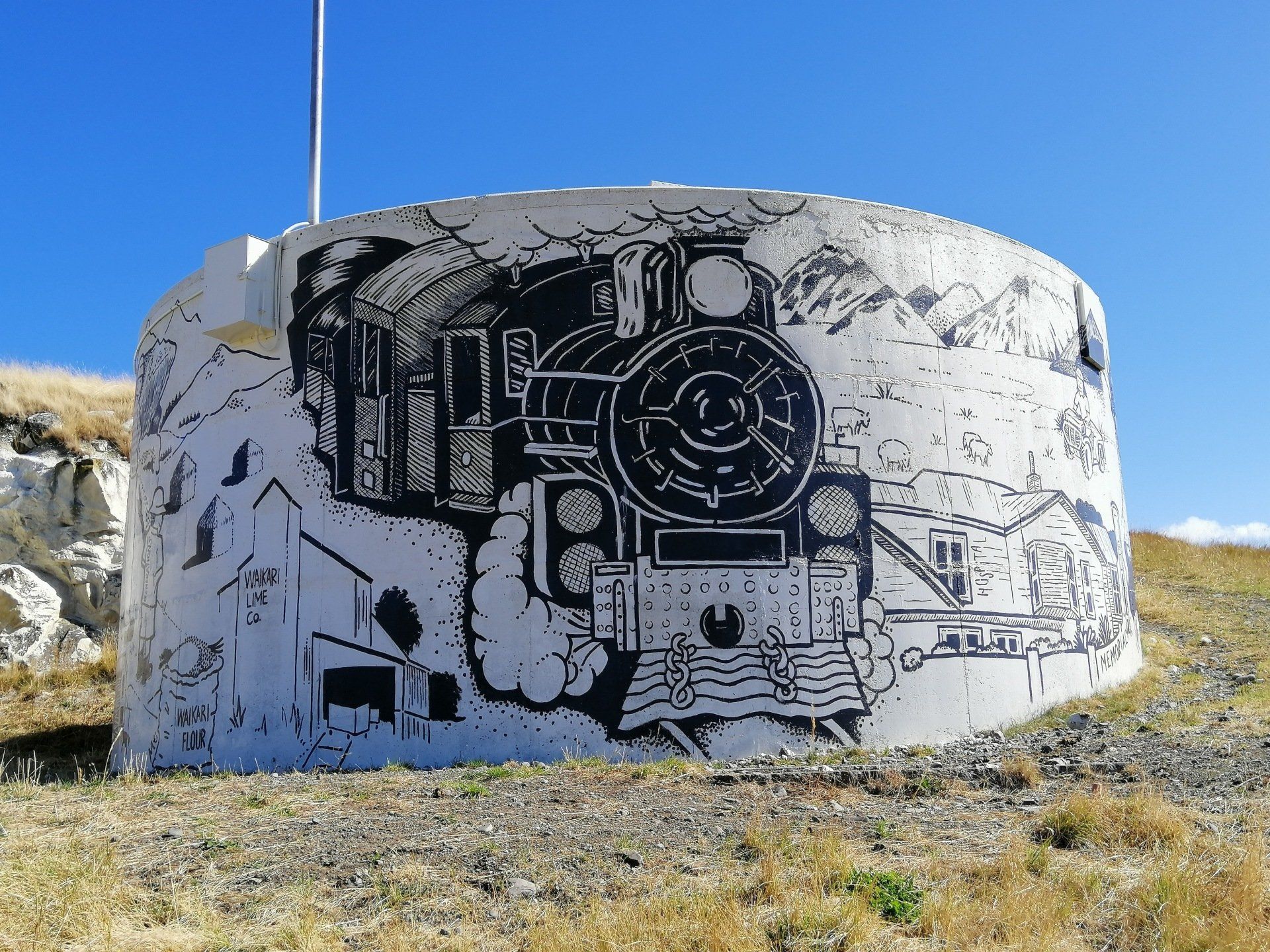 water tank, mural, water tank mural, artwork, waikari, hanmer, concrete, black and white, farming, history, waikari flour mill, waikari train, steam train, waikari hospital, waikari pub, maori rock painting, frog rock, farming families, quad bike, lime quarry, granddad, grandson, wheat stack, north canterbury, nz