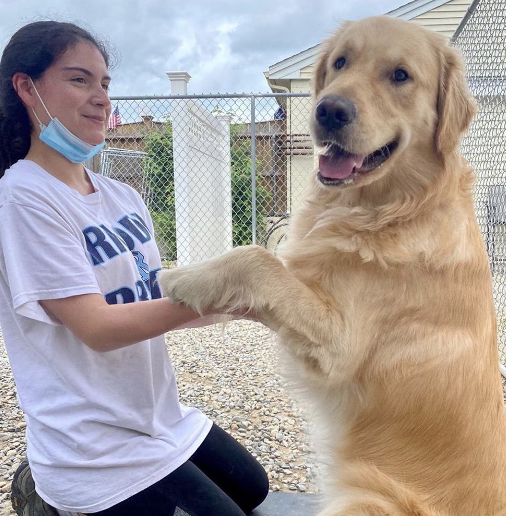 A woman wearing a white shirt that says rin on it.