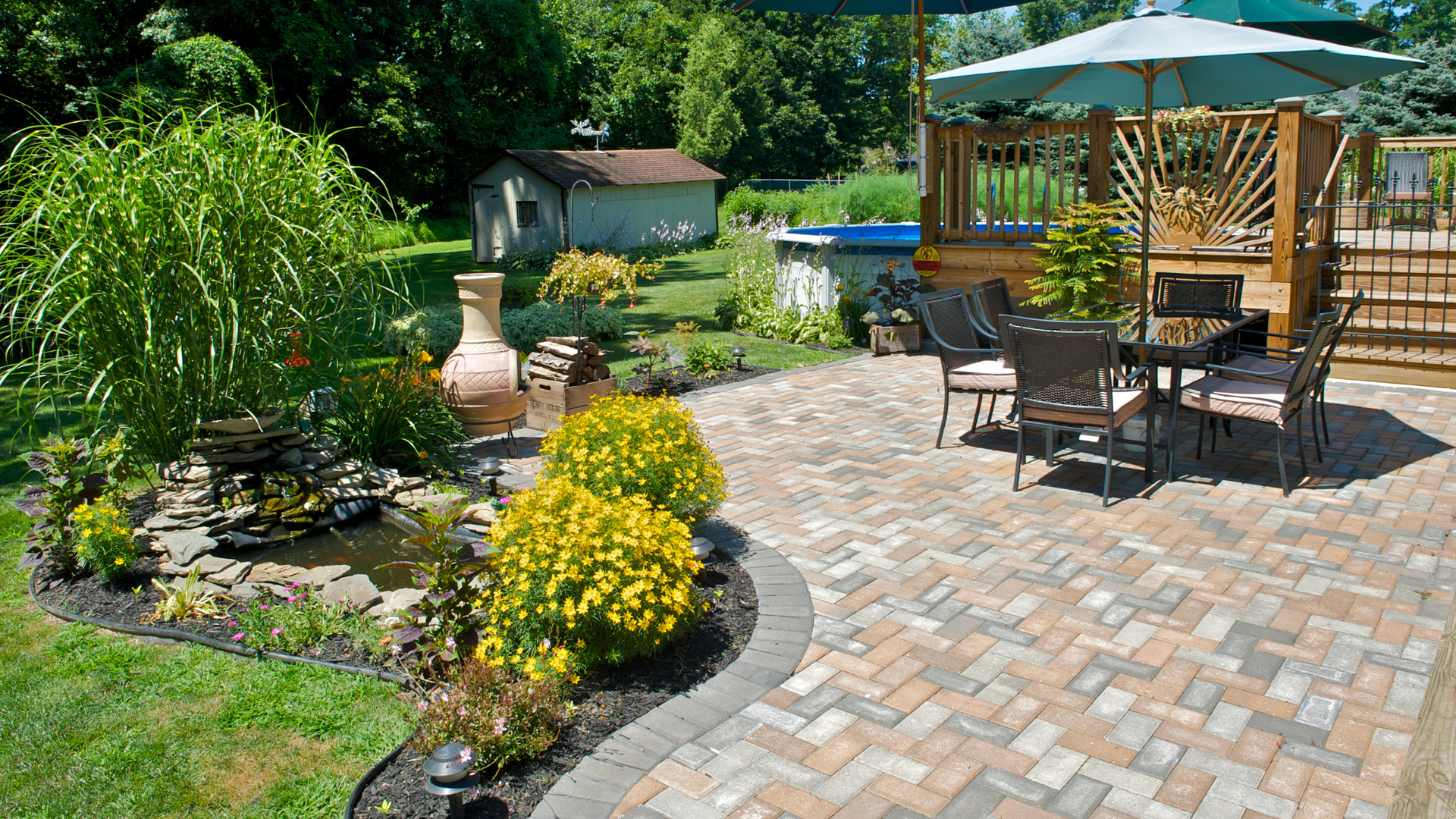 Relaxing outdoor space featuring a brick patio with a table and chairs for enjoying the fresh air.