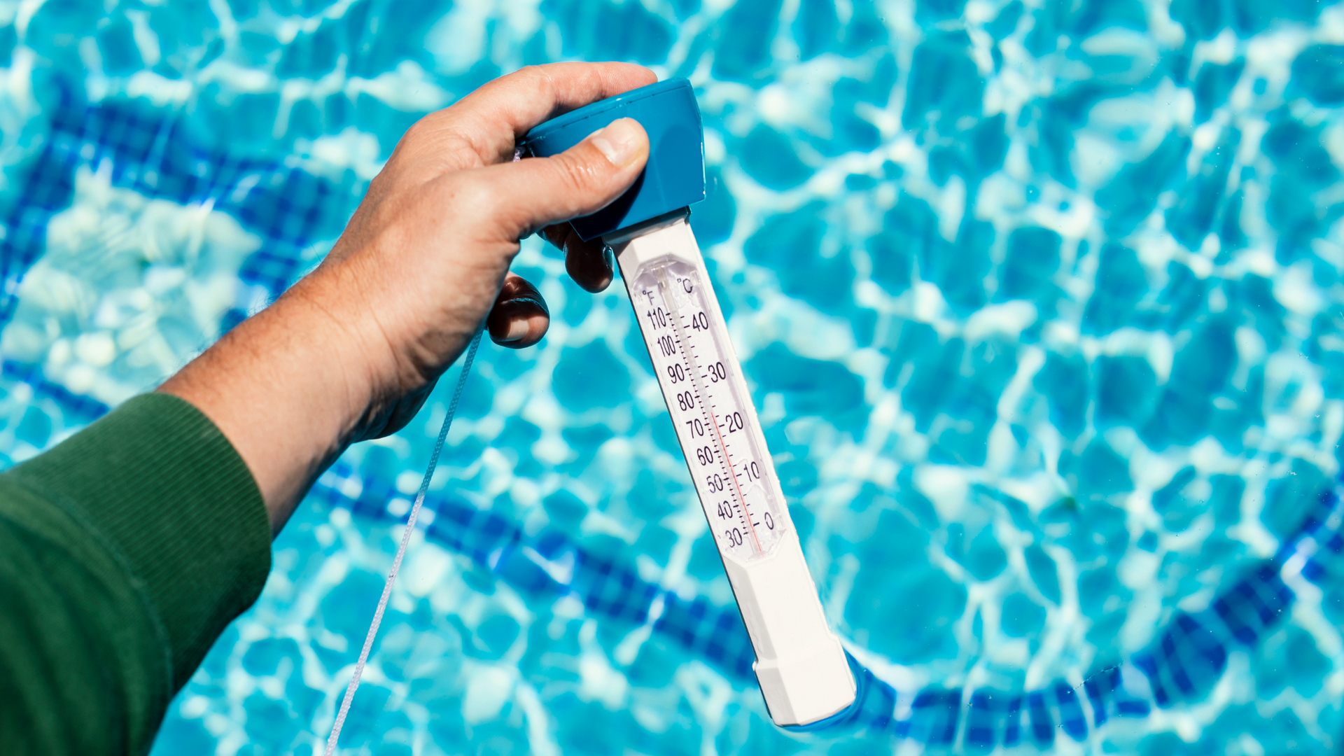 a pool guy keeping eye on water temperature