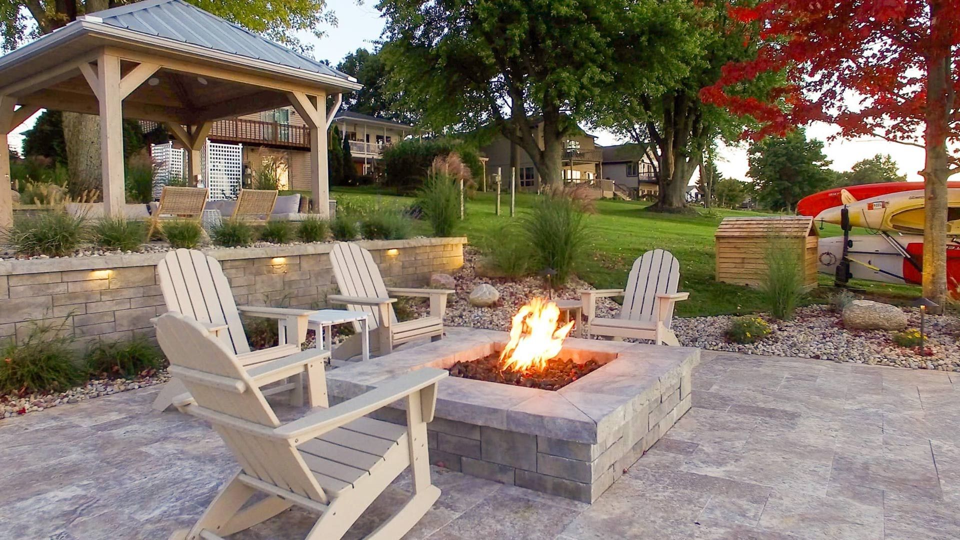 There is a fire pit in the middle of the patio.