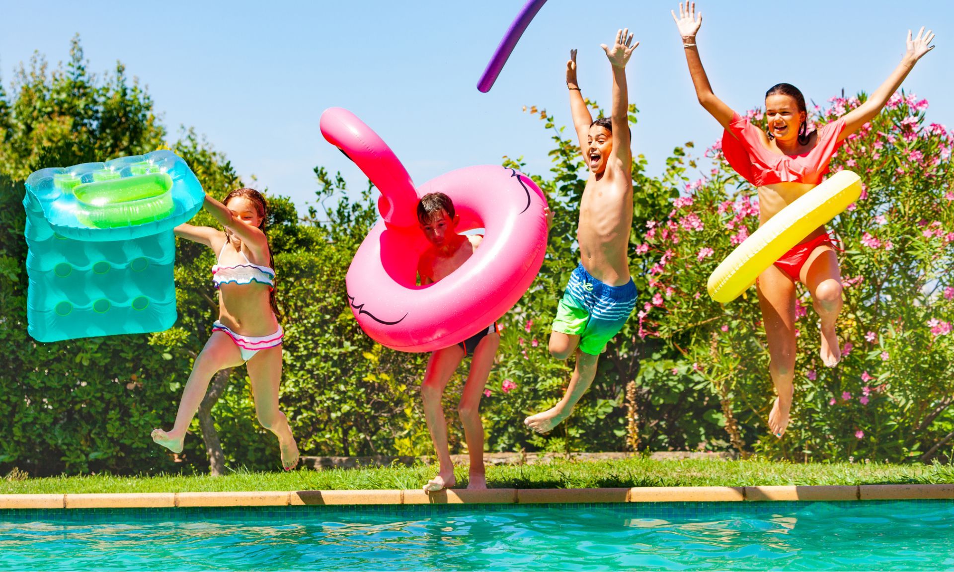 kids about to jump on the pool with floaters on