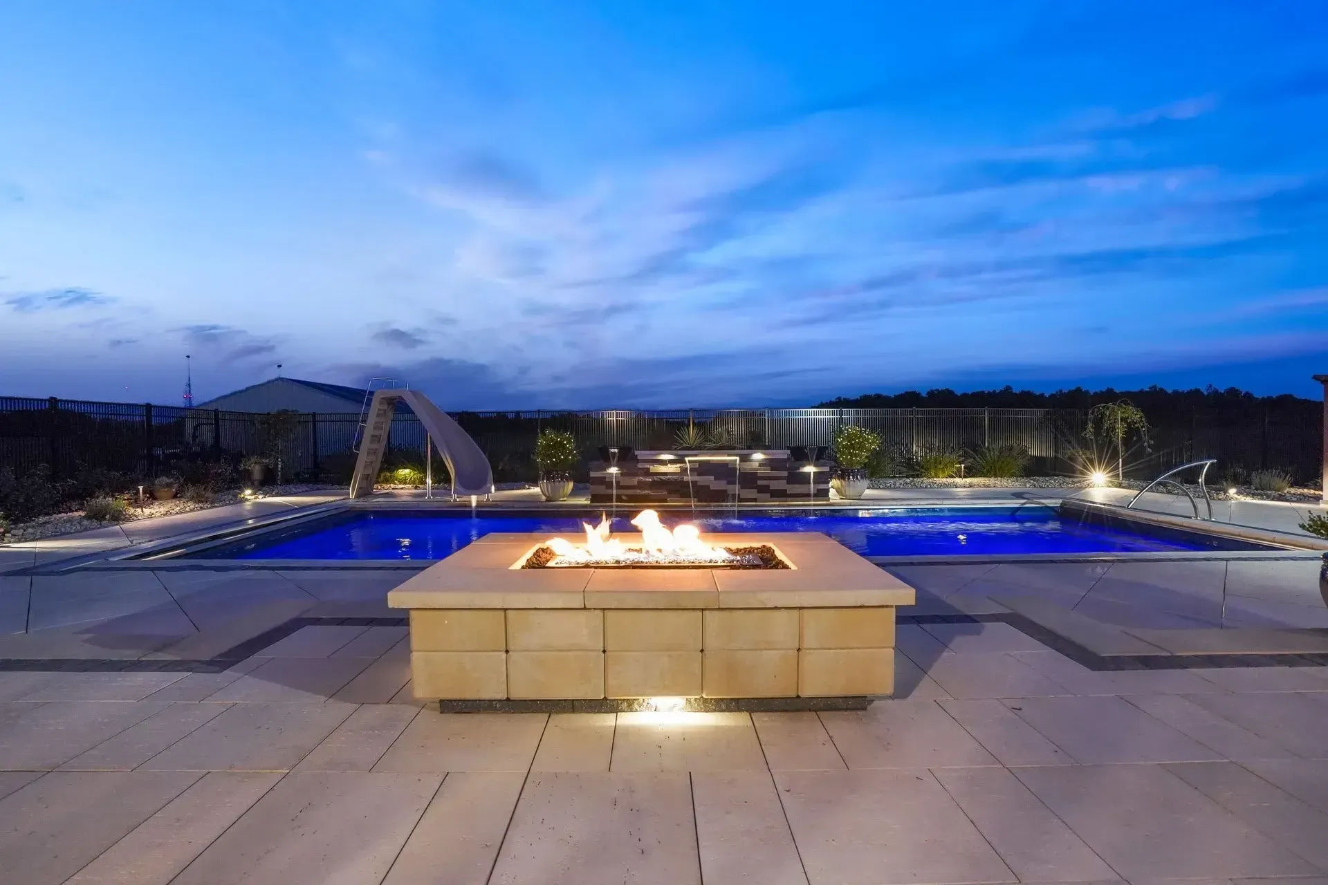 There is a fire pit in the middle of the pool.