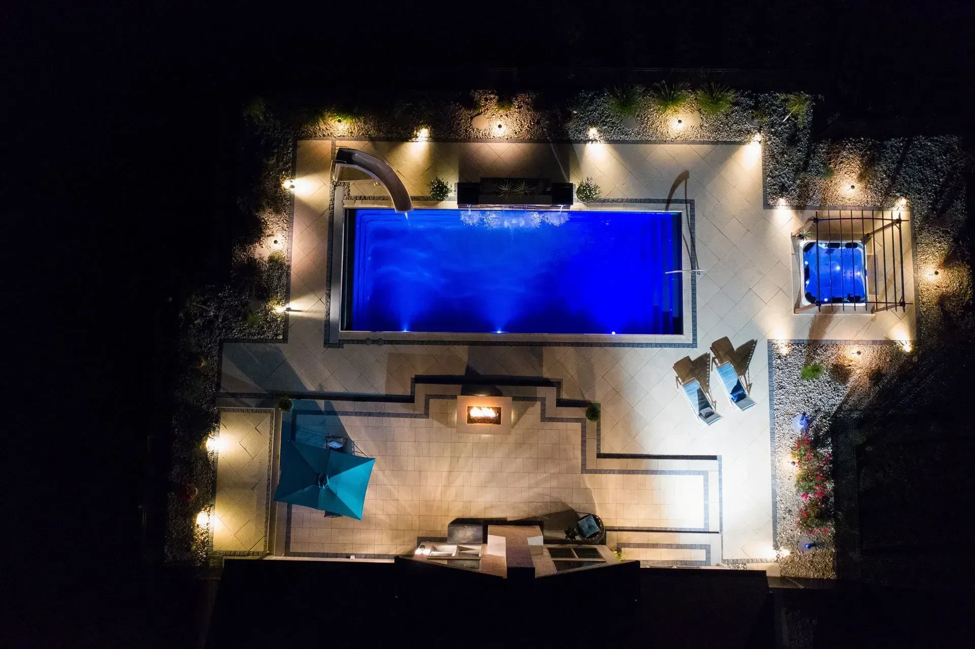 An aerial view of a large swimming pool at night