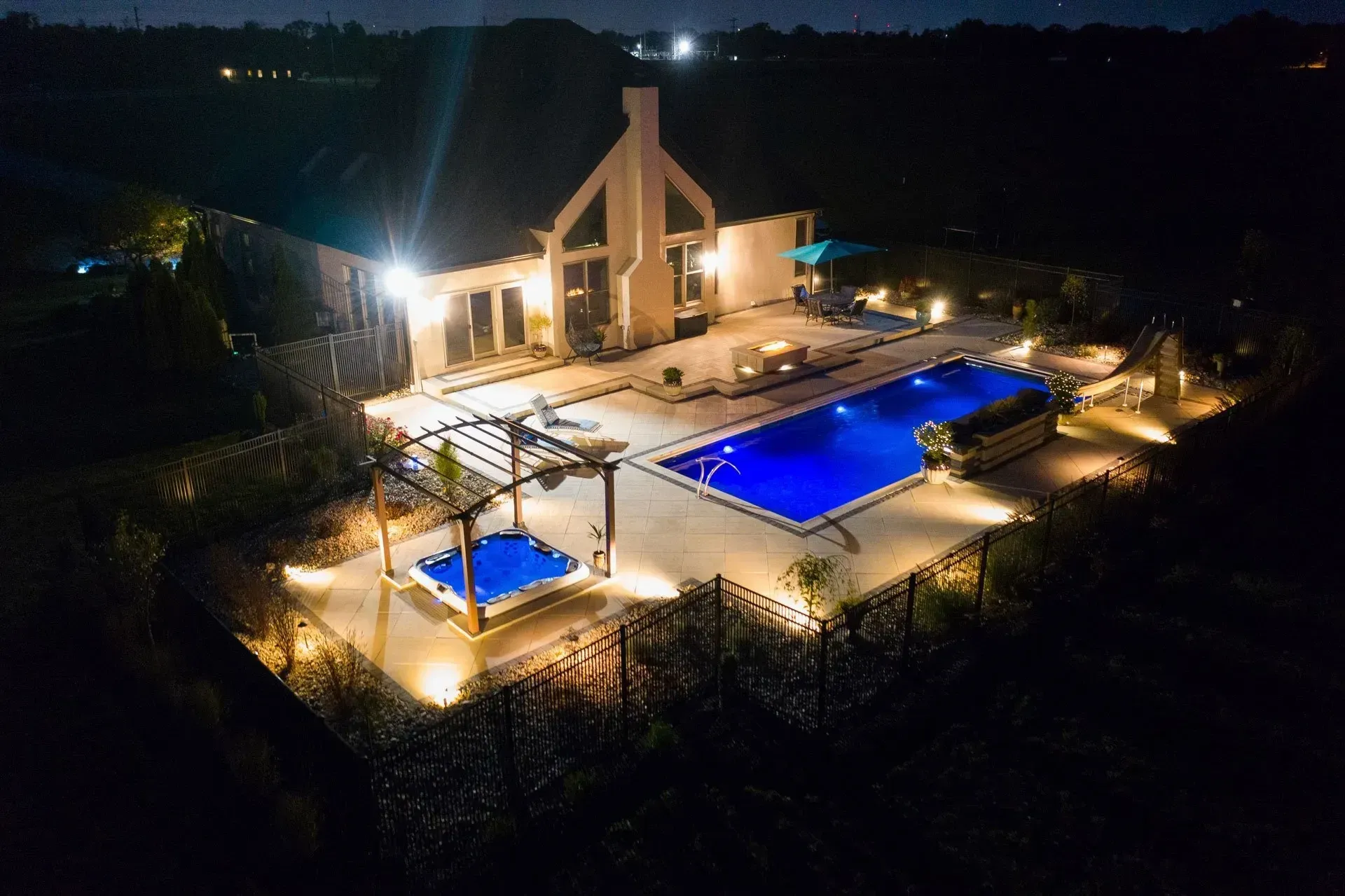 An aerial view of a large swimming pool at night