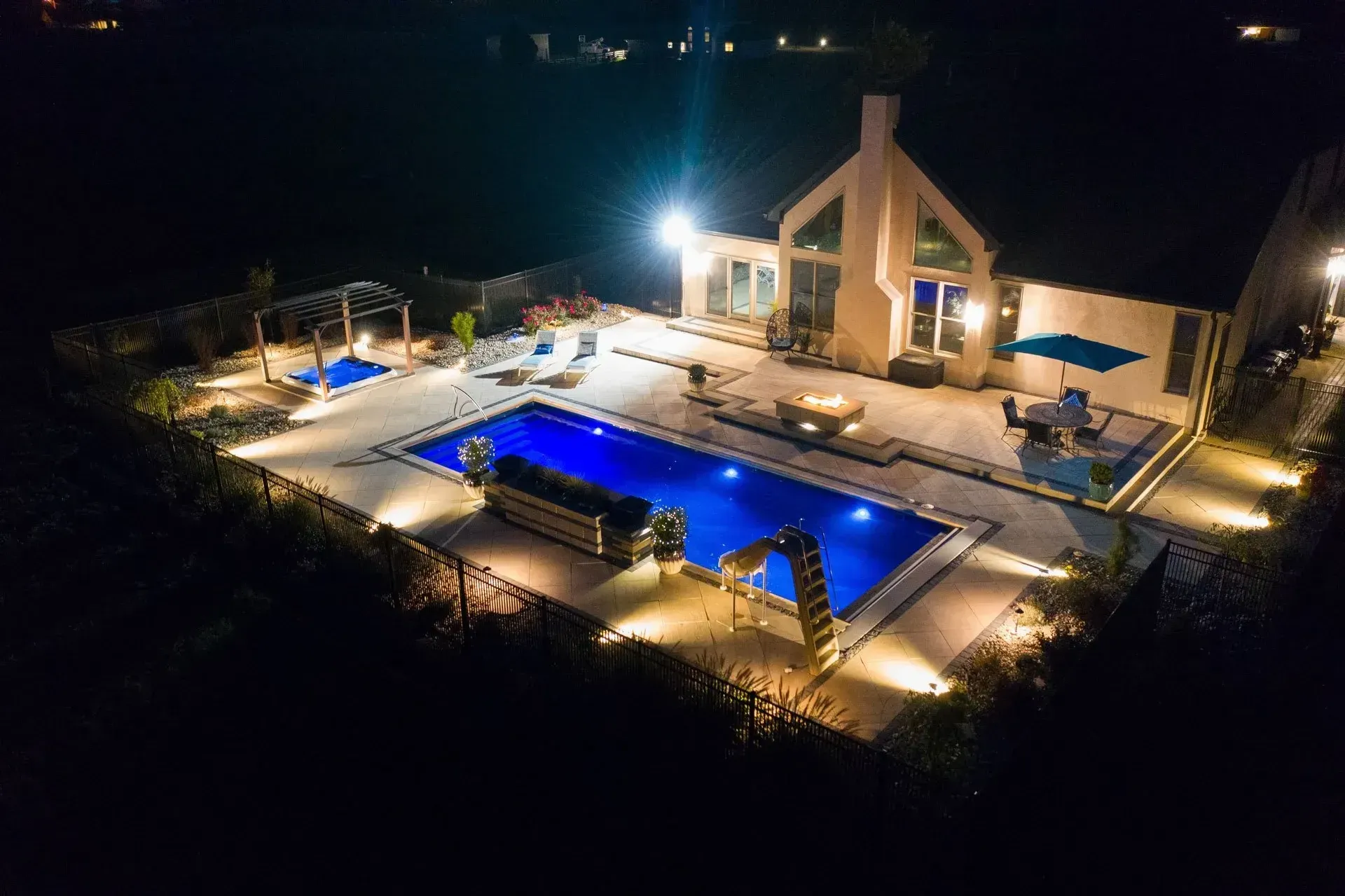An aerial view of a large swimming pool at night
