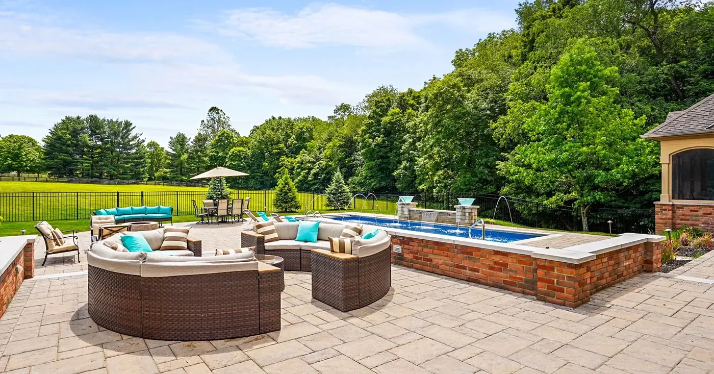 Top 10 Materials to Consider for a New Backyard Patio - Omni Pools & Scapes