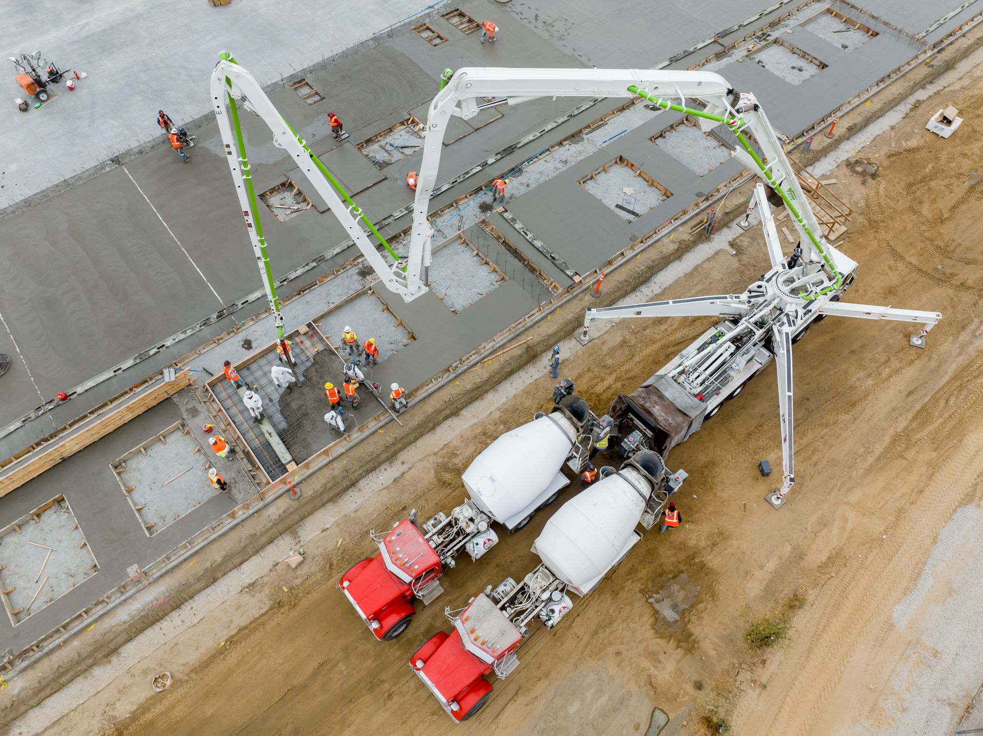 An aerial view of a concrete pump on a construction site.