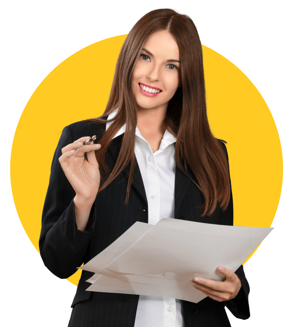 A woman in a suit is holding a piece of paper and a pen.