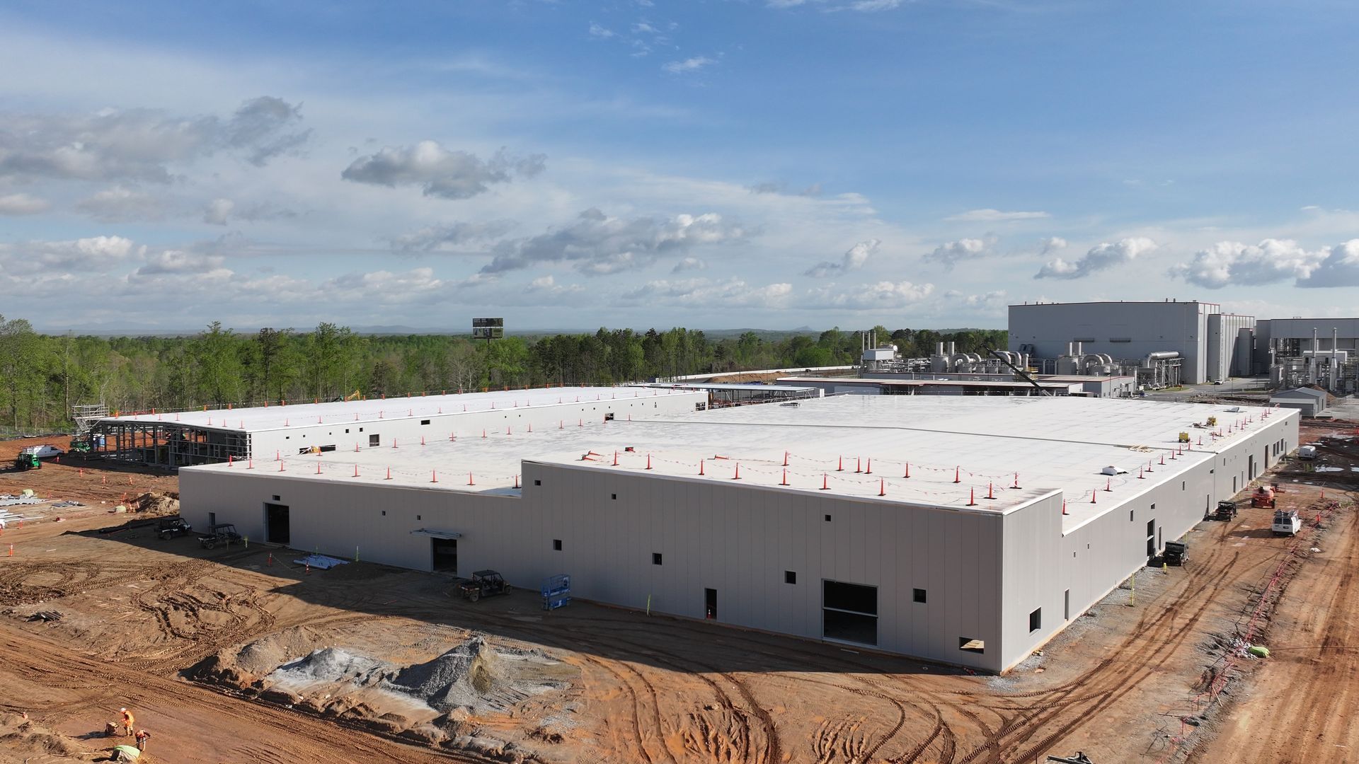 An aerial view of a large building under construction.