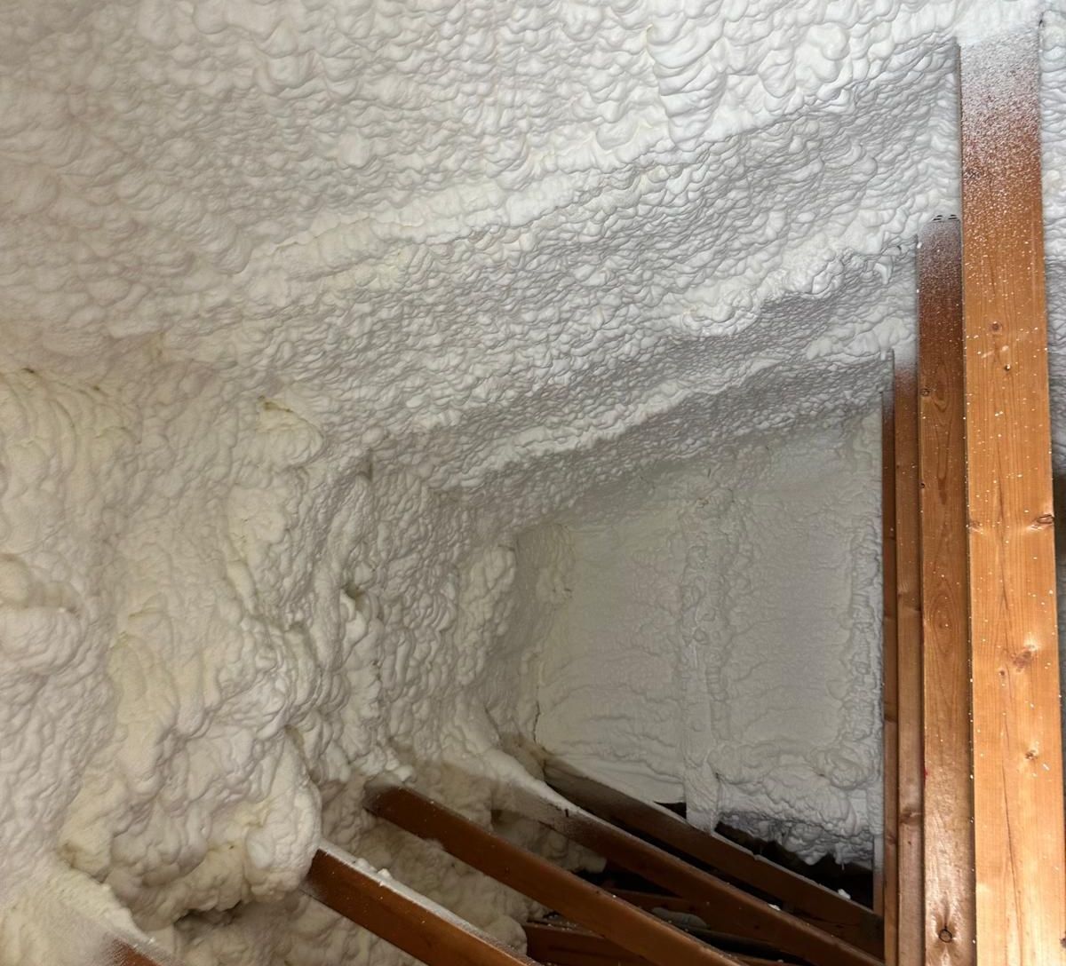 Spraying foam in the ceiling of a house in Sun City, Arizona.