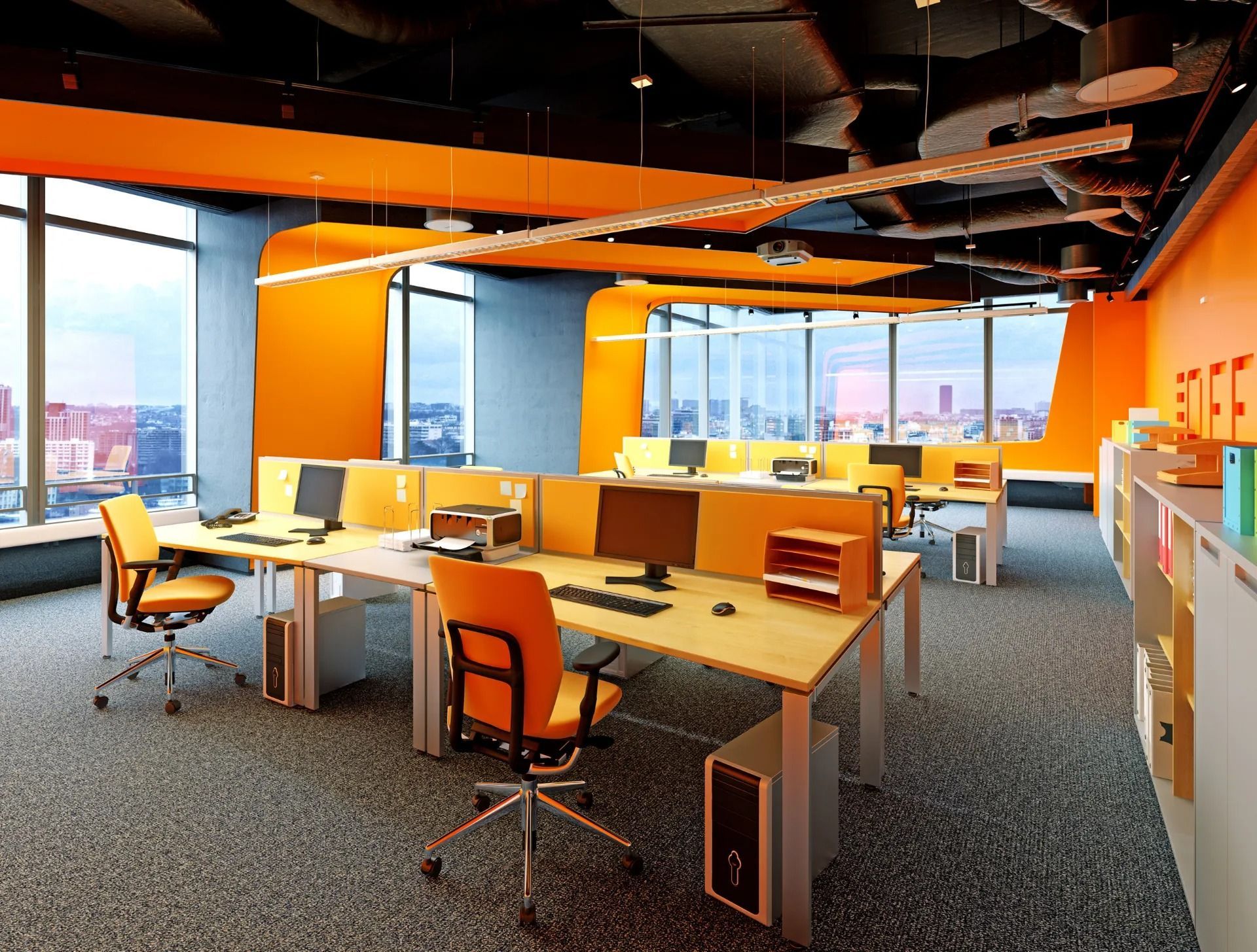 A large office with orange walls and a lot of windows
