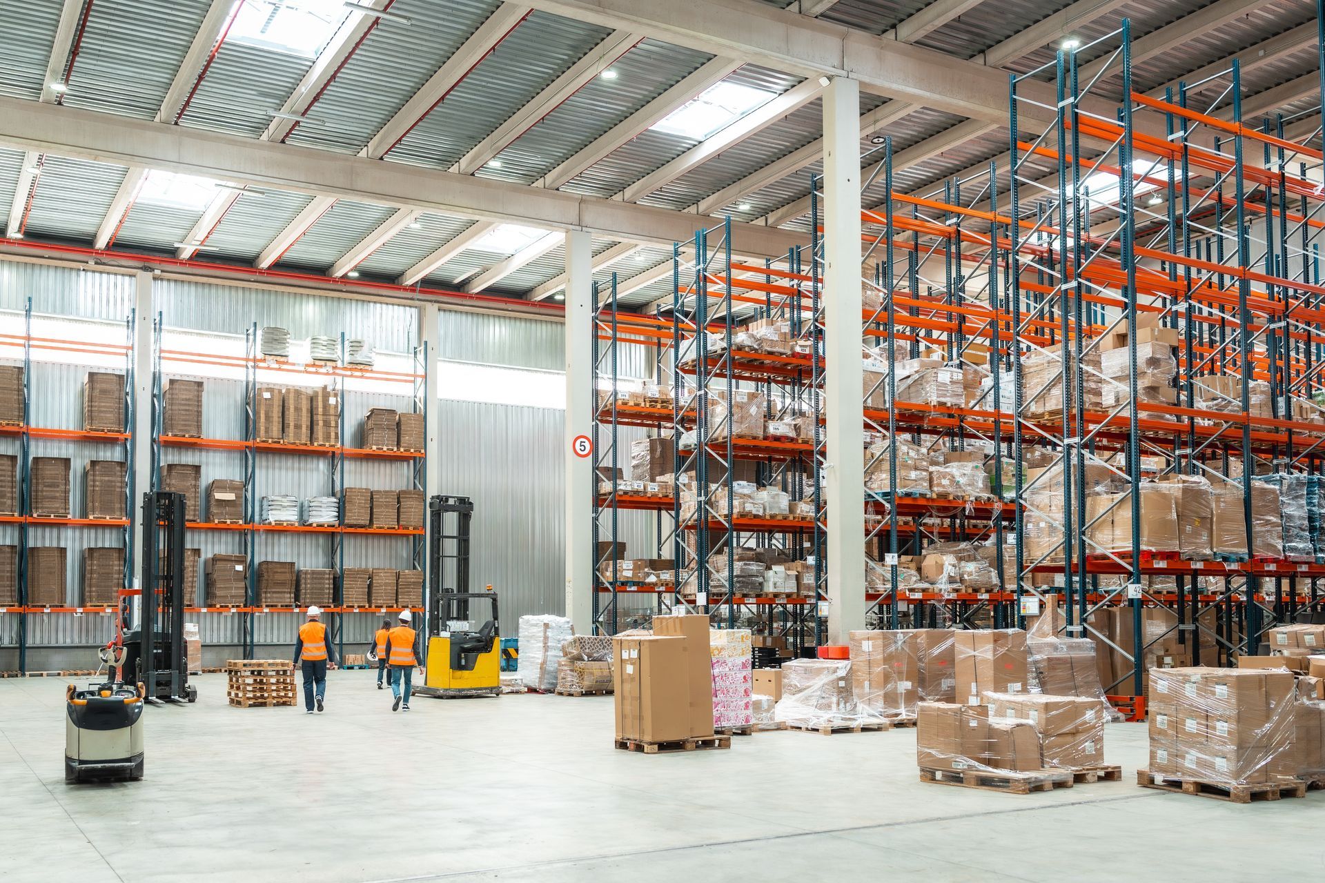 A large warehouse filled with lots of boxes and shelves.