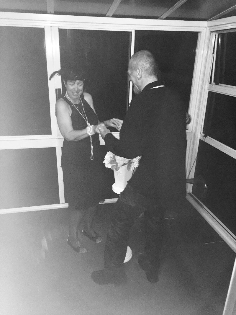 A man and a woman are standing next to each other in a room