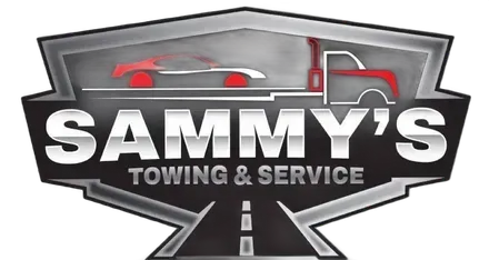 Logo for Sammy's Towing & Service, showing a red car being towed by a red truck on a highway.