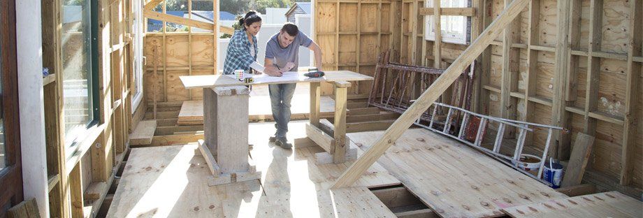couple looking at plans for their home