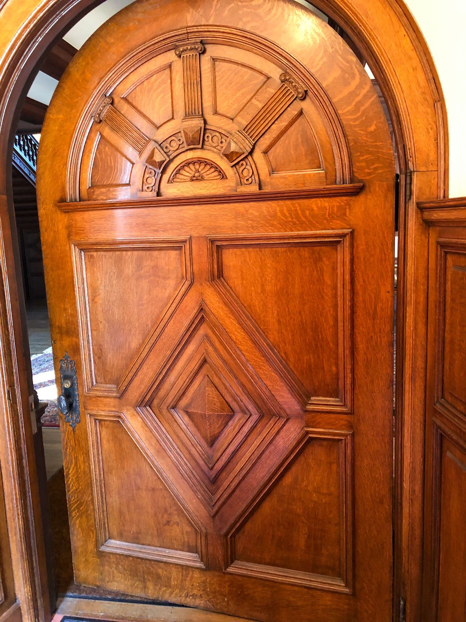 A wooden door with a carved design on it