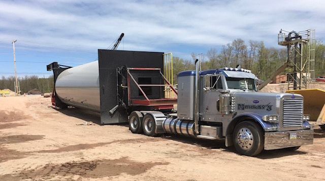 Murray's Tractor Trailor hauling materials