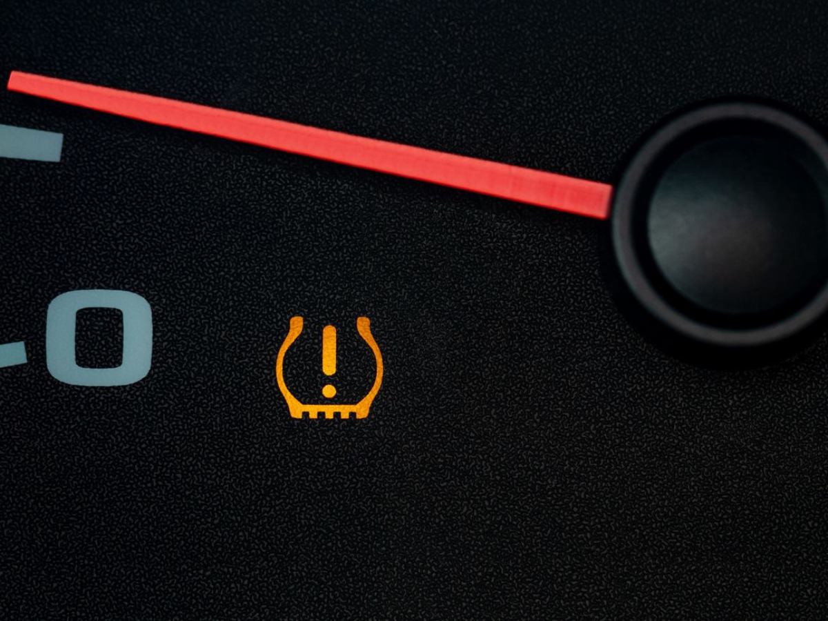 A close up of a tire pressure gauge on a car
