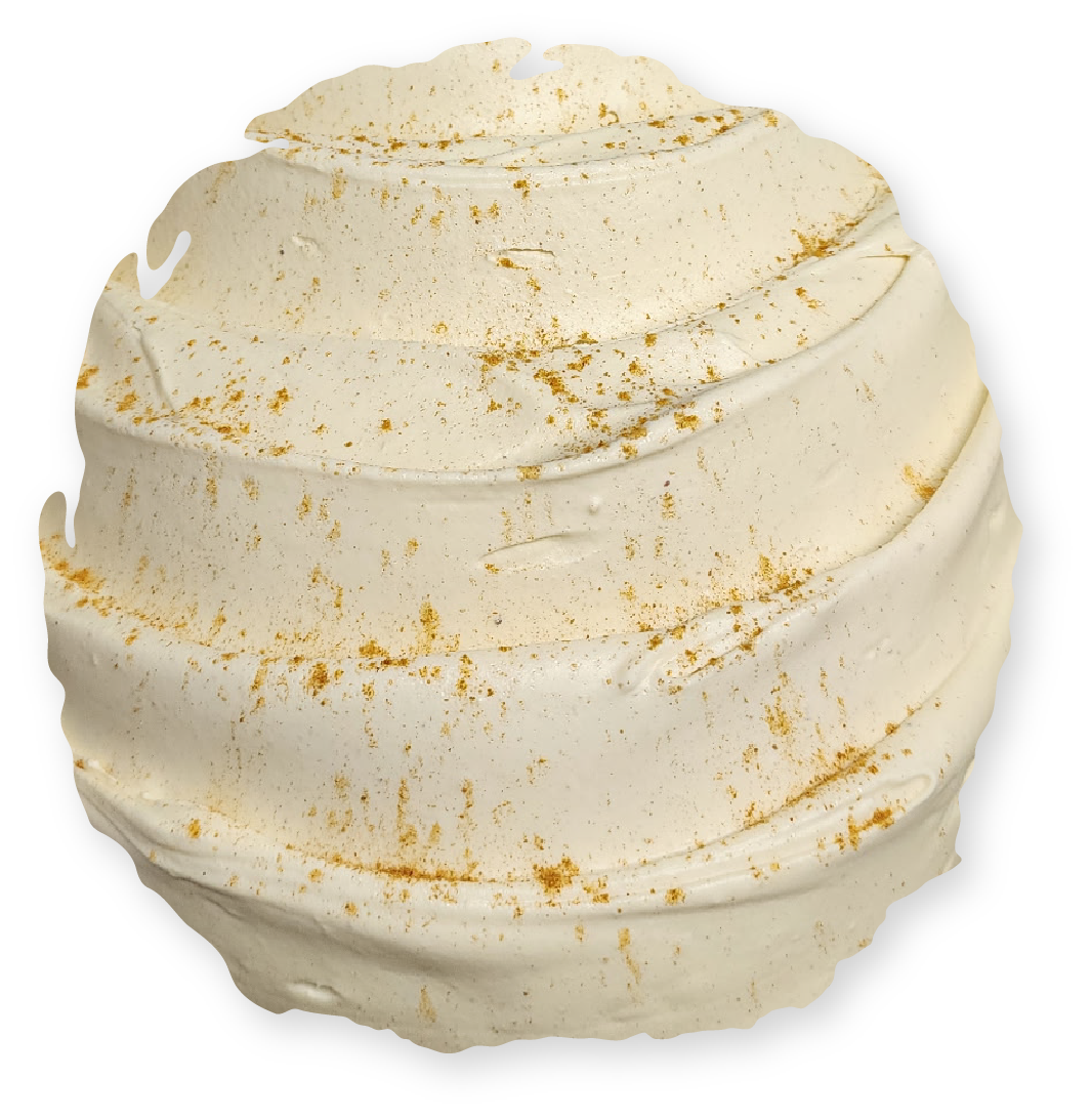 Creamy white bath bomb with spiral grooves, speckled with gold flecks.