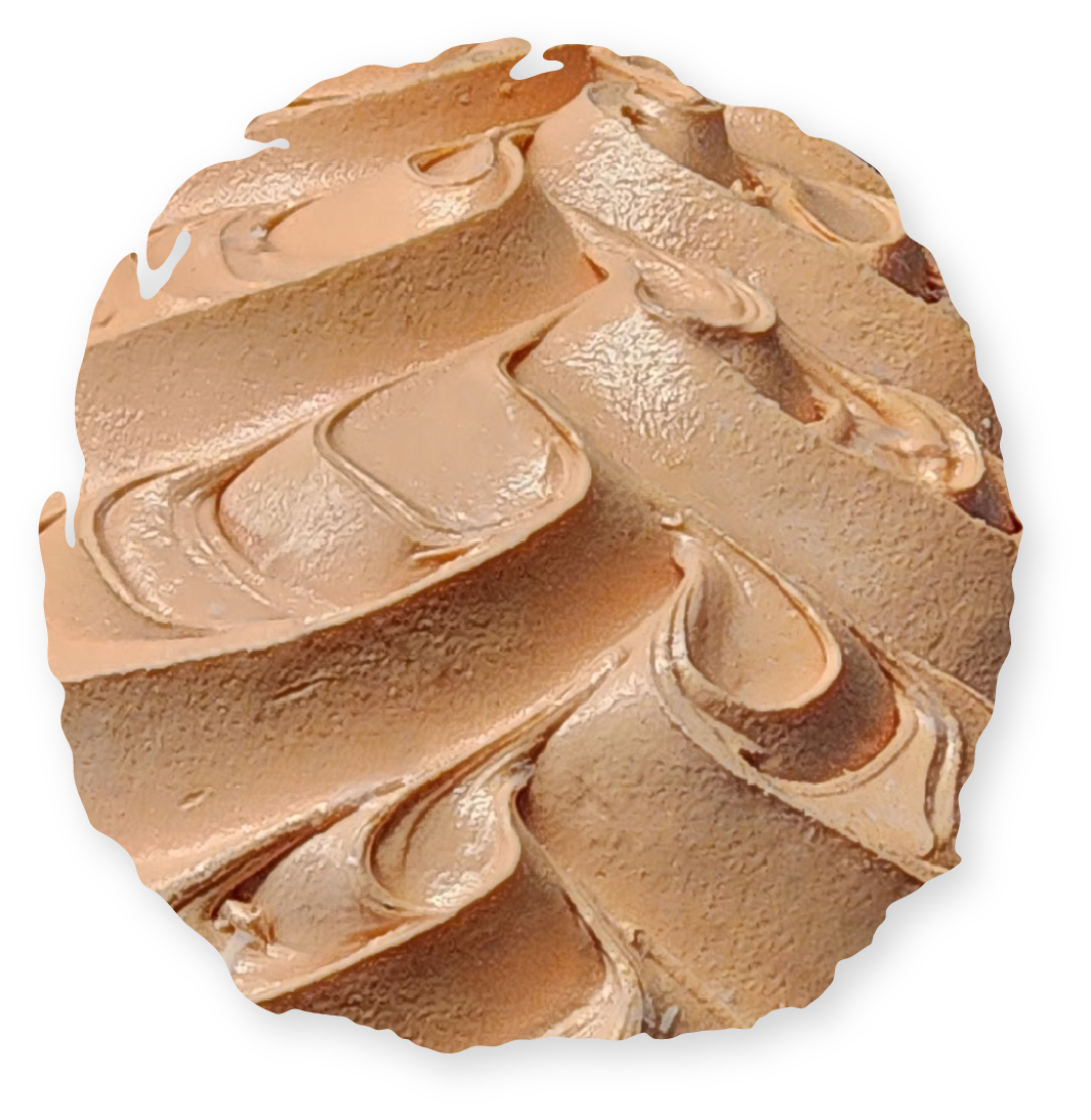 Swirled tan frosting in a circular pattern.