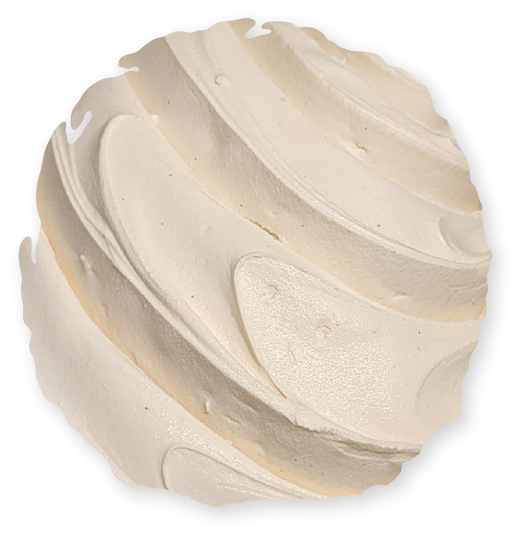 Swirled, off-white frosting with subtle shimmering highlights, possibly on a dessert.