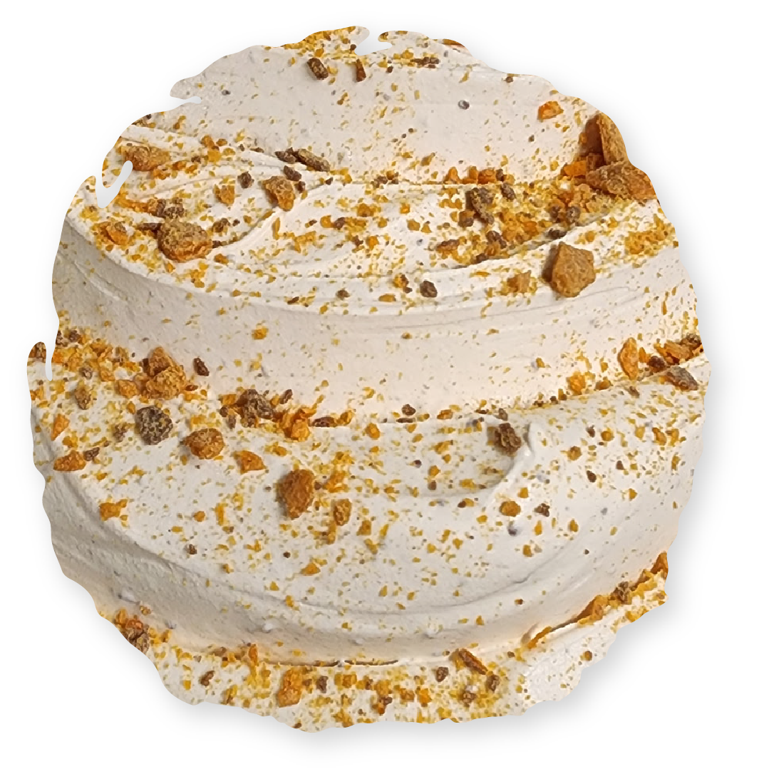 Ice cream scoop with caramel and crumbled toppings.