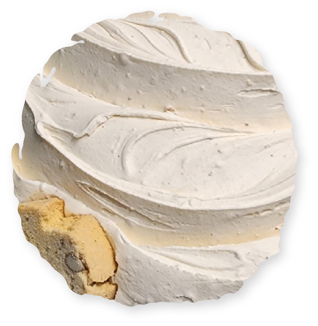 Whipped cream with a slice of biscotti on a white background.