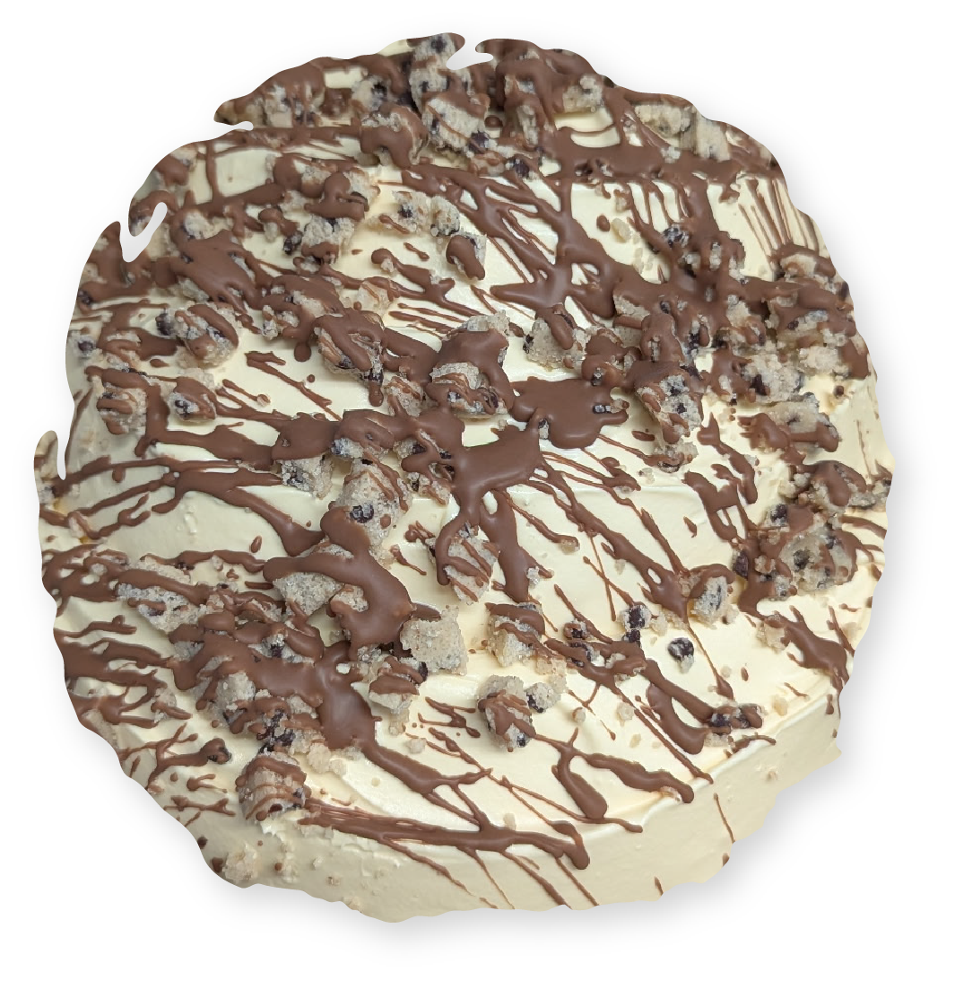 Cookies and cream cake, drizzled with chocolate, garnished with cookie crumbles.