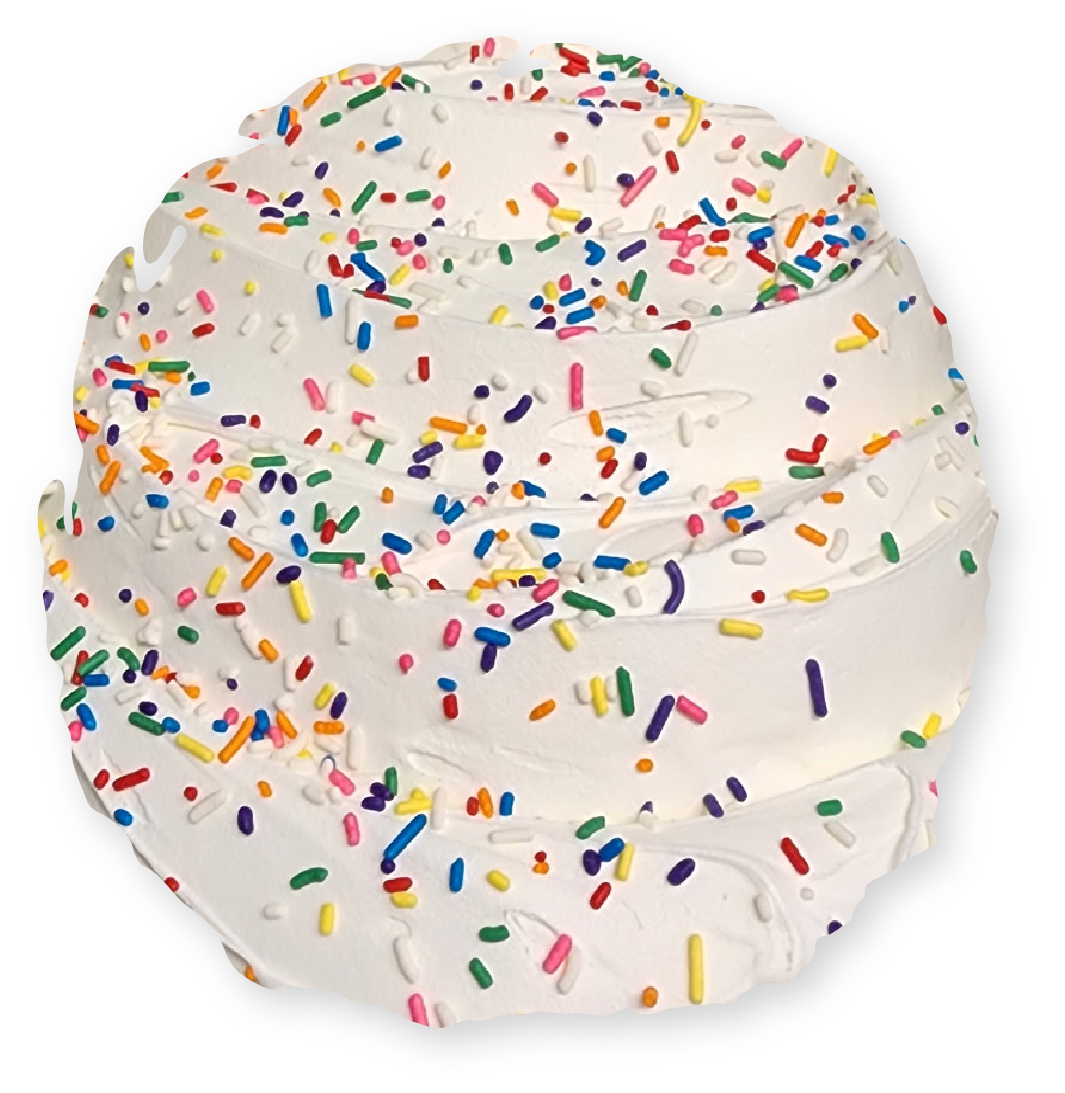 Whipped cream swirl with colorful sprinkles.