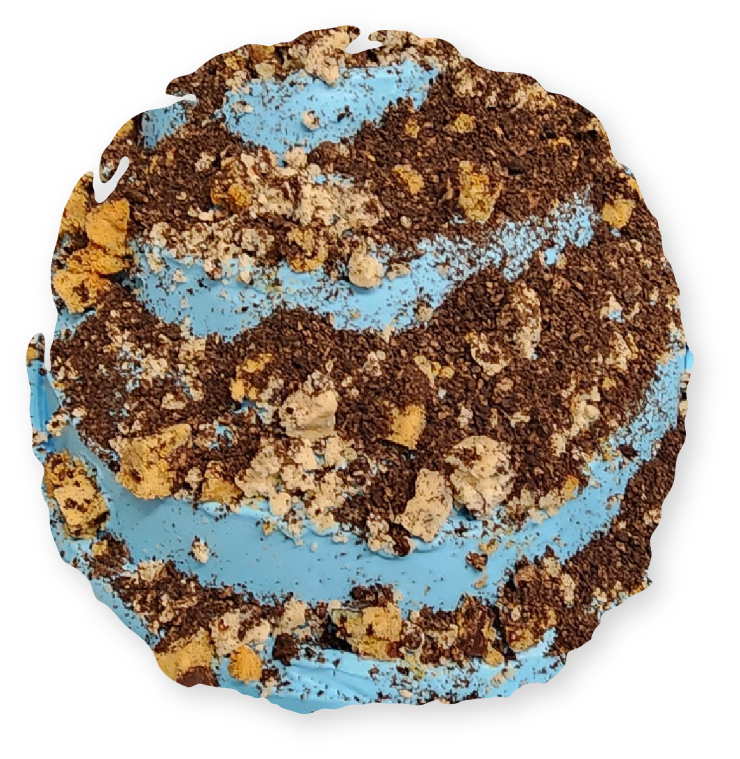 Blue ice cream swirl topped with chocolate and cookie crumbs.