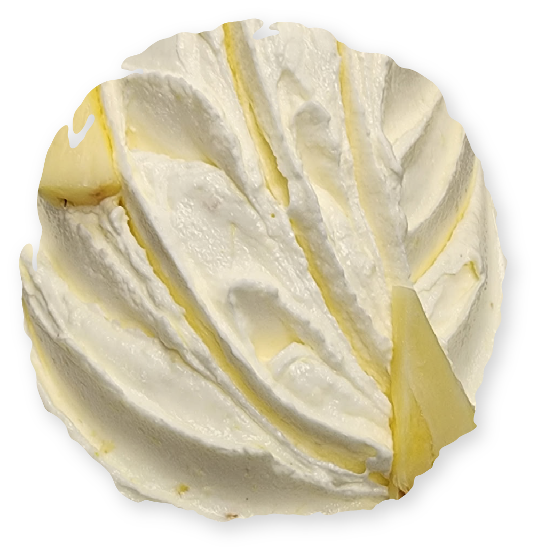 Round of white creamy cheese with a section cut out.